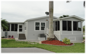 Front view of a house with stairs and a screened room