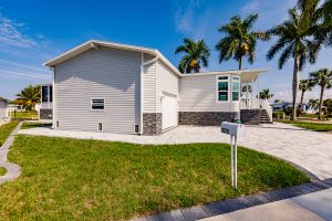 Side view of a house with a garage and stairs