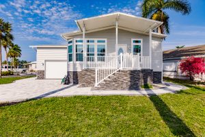 Front view of a house with a garage and stairs