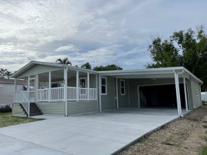 Angled view of a house with a garage and stairs