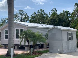 Back view of a house with a shed